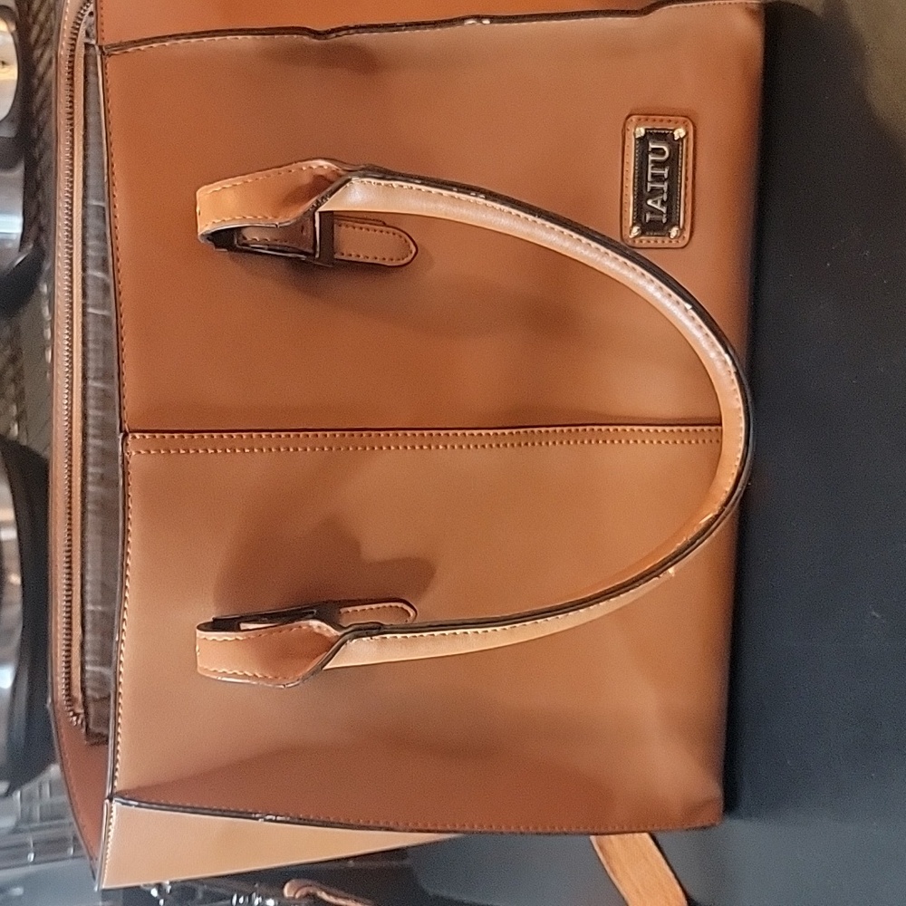 Tote barely used multiple pockets padded for laptop